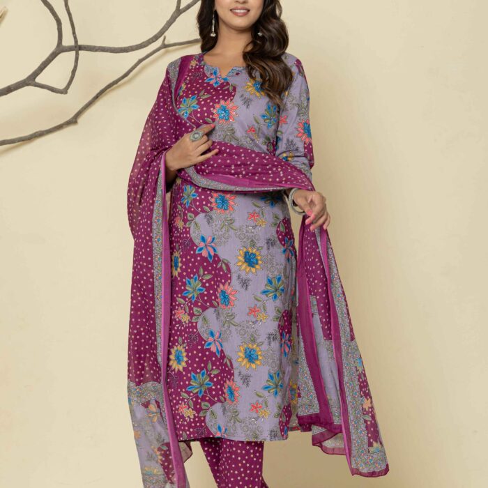 Woman wearing a purple floral printed kurti pant dupatta set