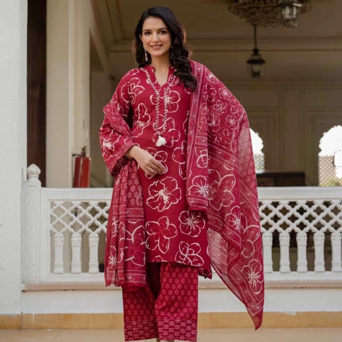 Red A-line kurta with bold white floral prints, paired with matching Farsi salwar