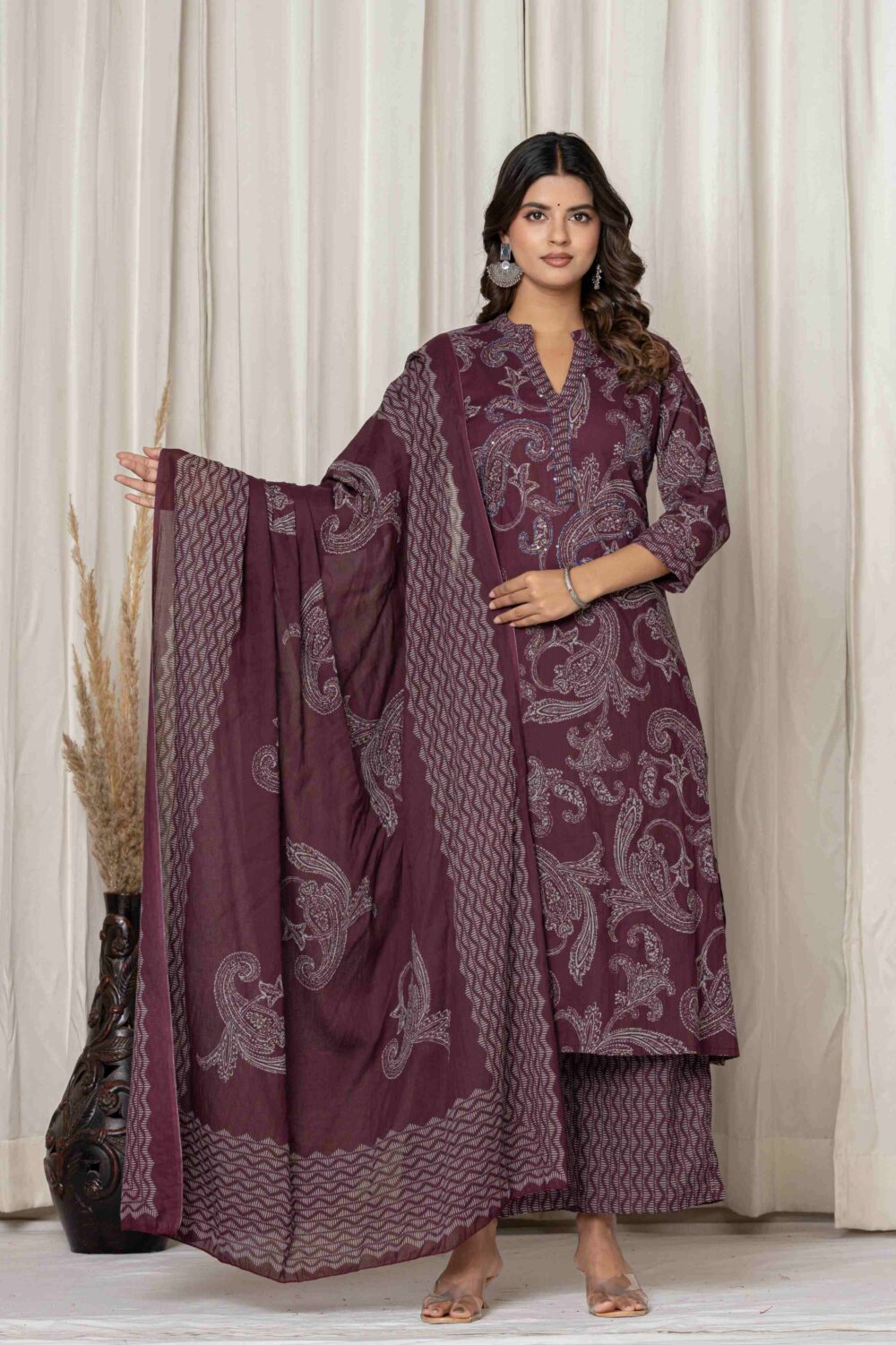 Maroon printed A-line kurta palazzo and dupatta set for women with ethnic paisley design