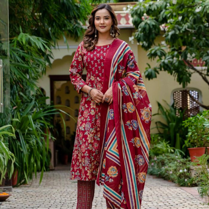 Red floral print cotton Anarkali suit with a matching dupatta and striped pants from HK Vastra.
