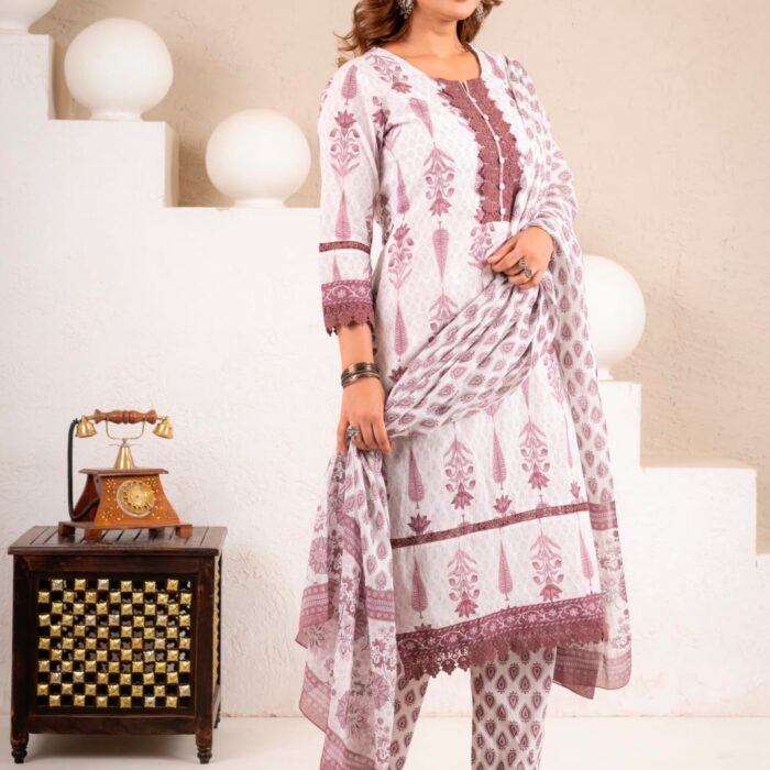 Model wearing a maroon and white floral printed kurti, matching pants, and dupatta set with lace detailing.