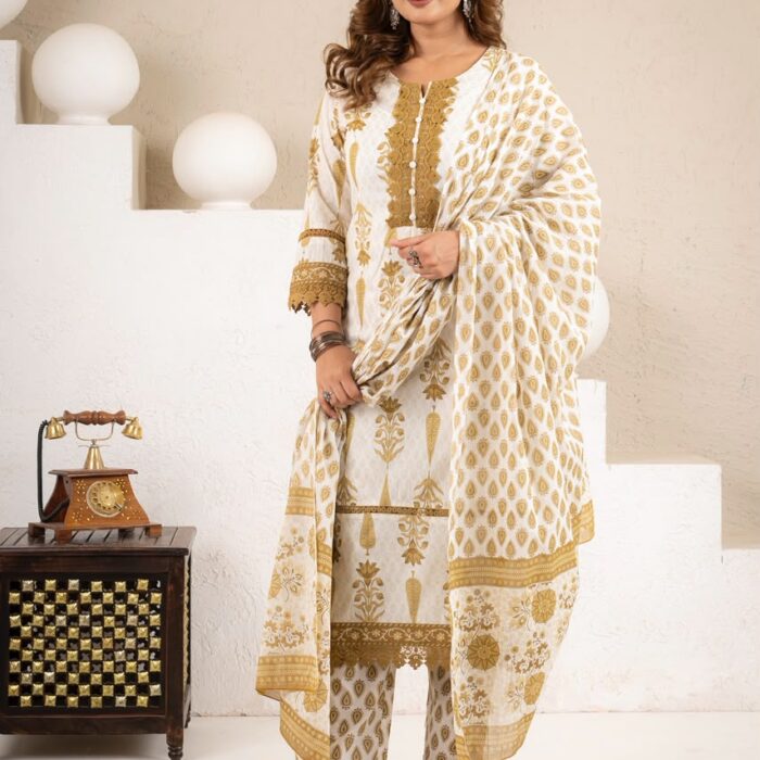 Model wearing an elegant white and mustard-gold ethnic kurti, pant, and dupatta set featuring traditional block prints and intricate lace detailing from HK Vastra.